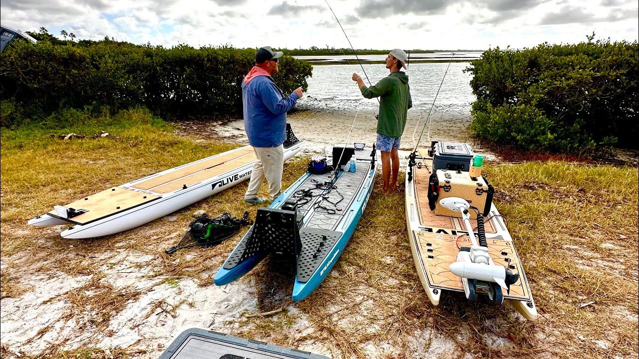 SUP Customs rigs being set up at a beach launch — no ramp needed